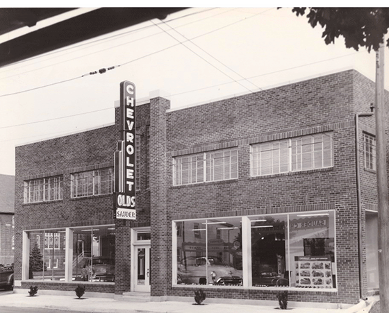 Picture of John Sauder Chevrolet auto business in the early 1900s